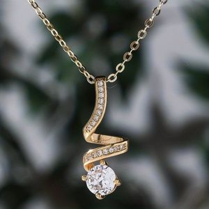Exquisite 18K Gold-Plated Zircon Pendant: Elegant Rotating Design